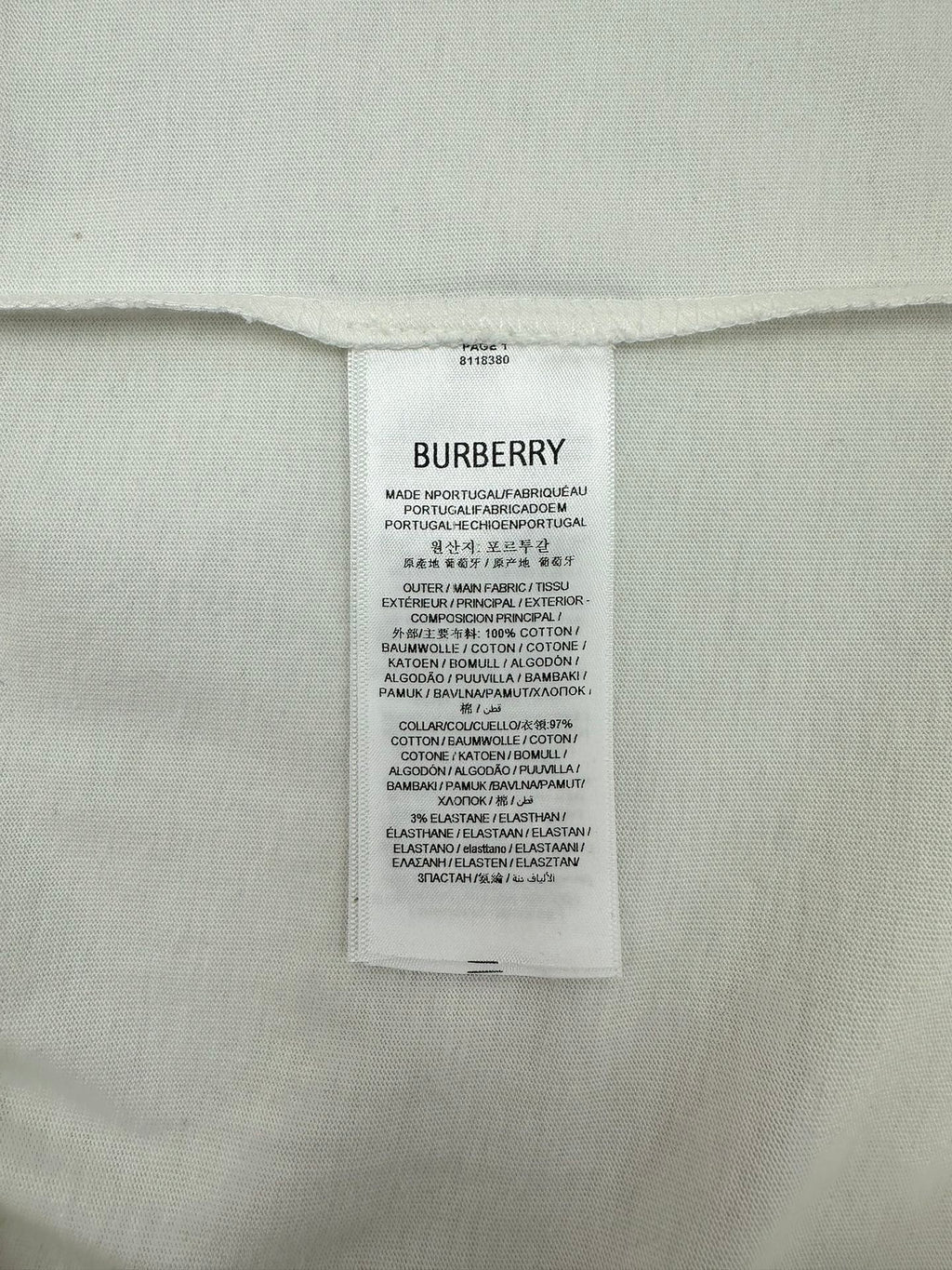 Burberry inner care label on white T-shirt with size and fabric info