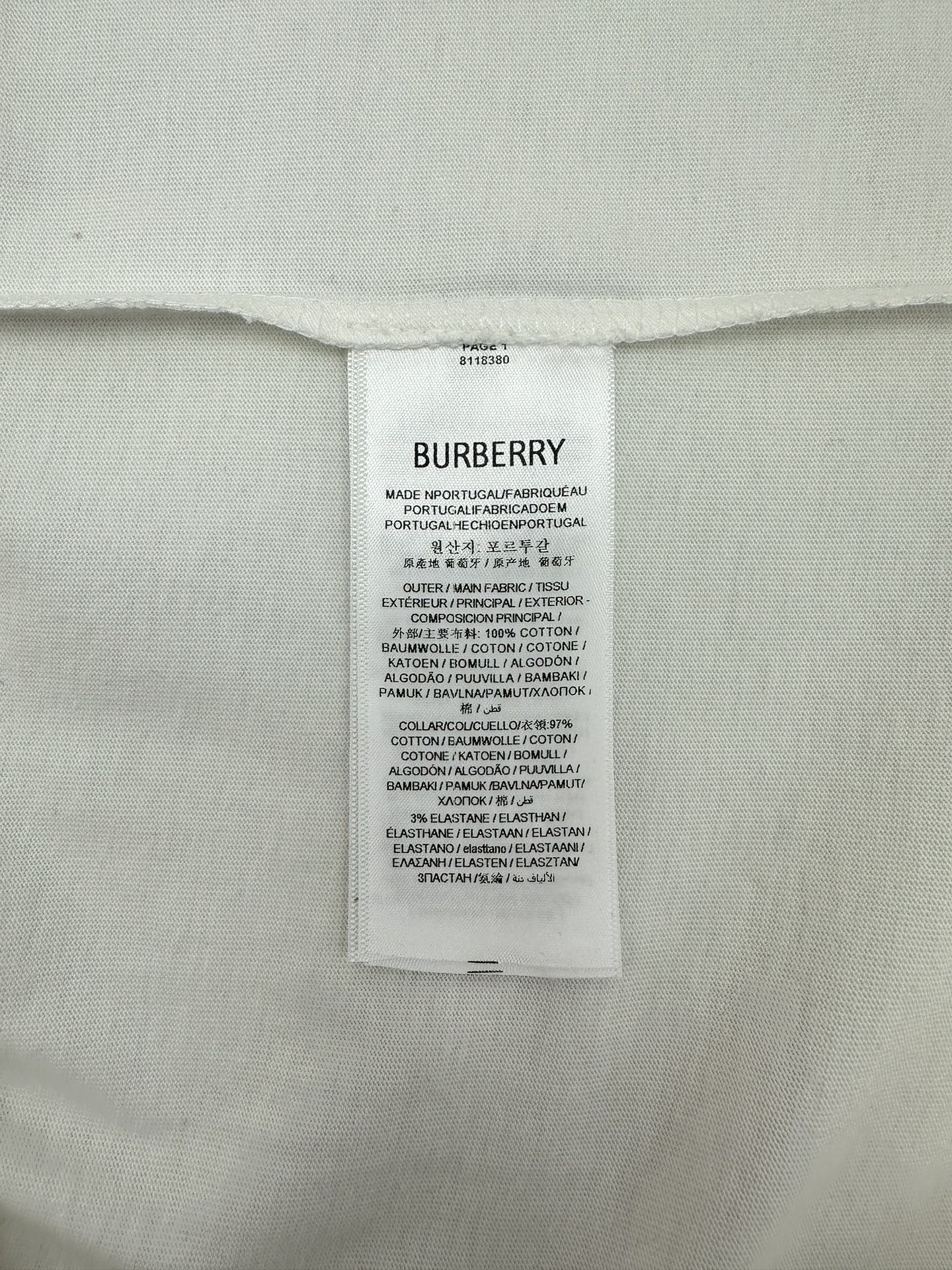 Burberry inner care label on white T-shirt with size and fabric info