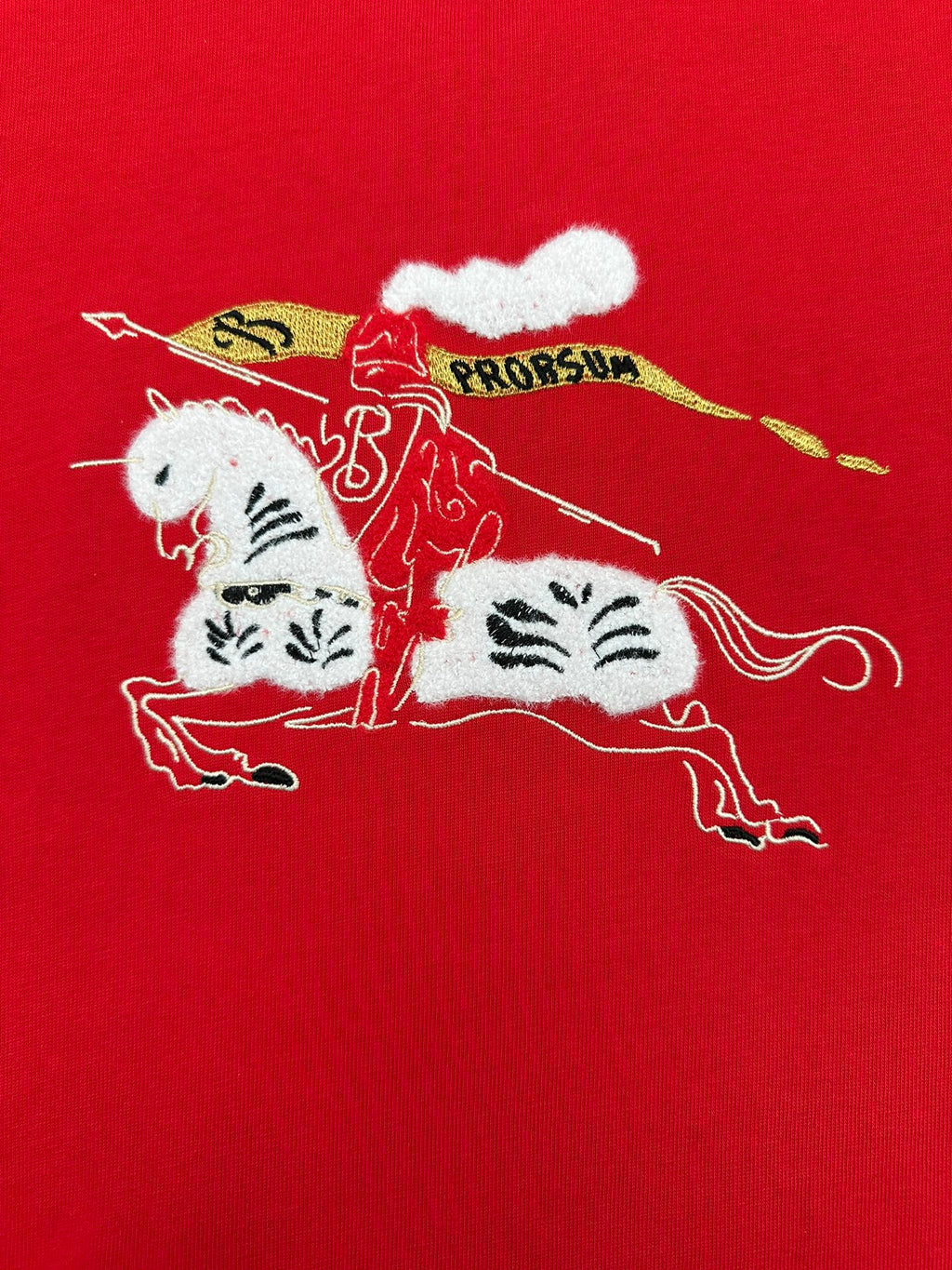 Red crew-neck T-shirt with large cat illustration and decorative text graphic