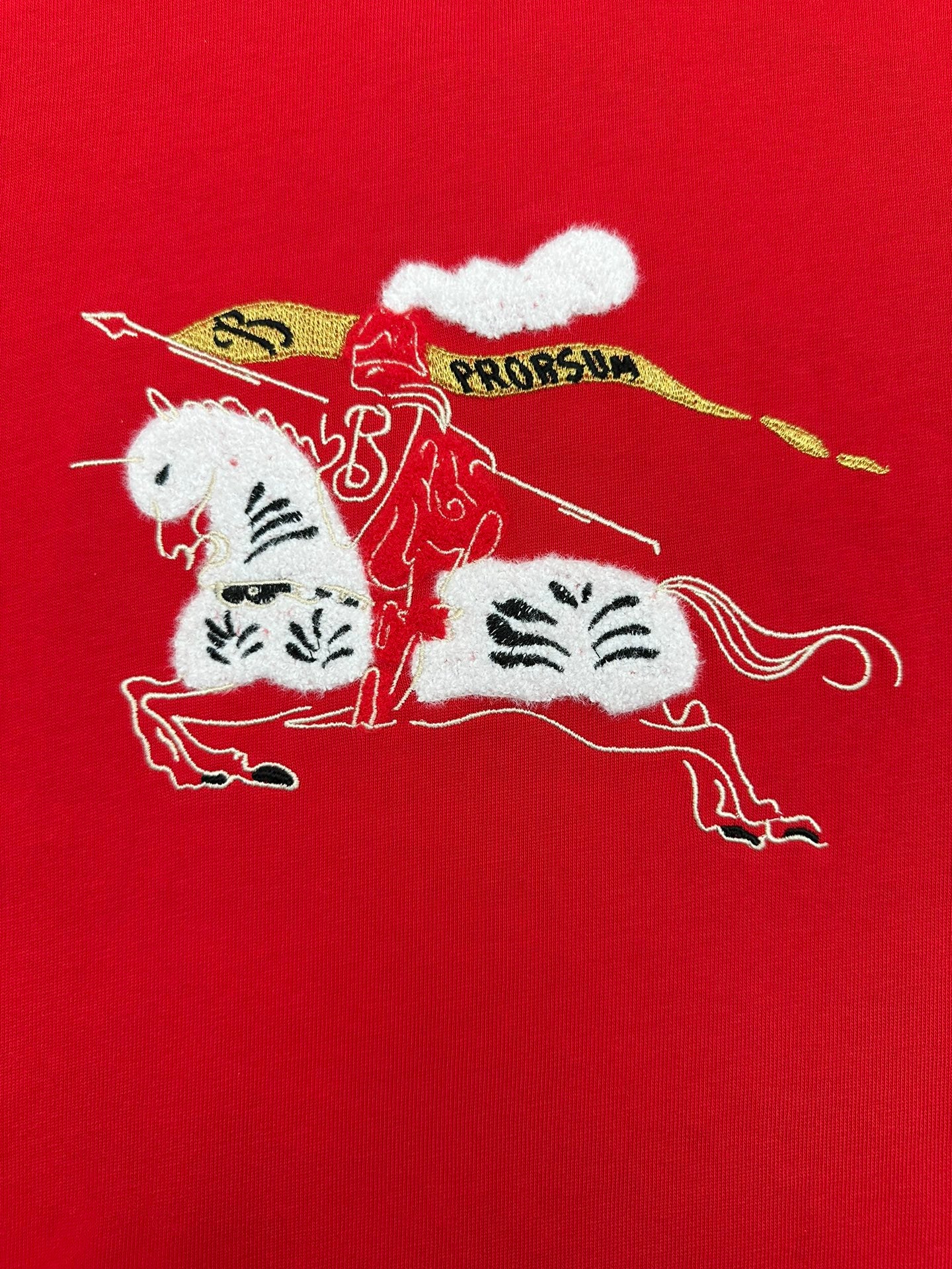 Red crew-neck T-shirt with large cat illustration and decorative text graphic