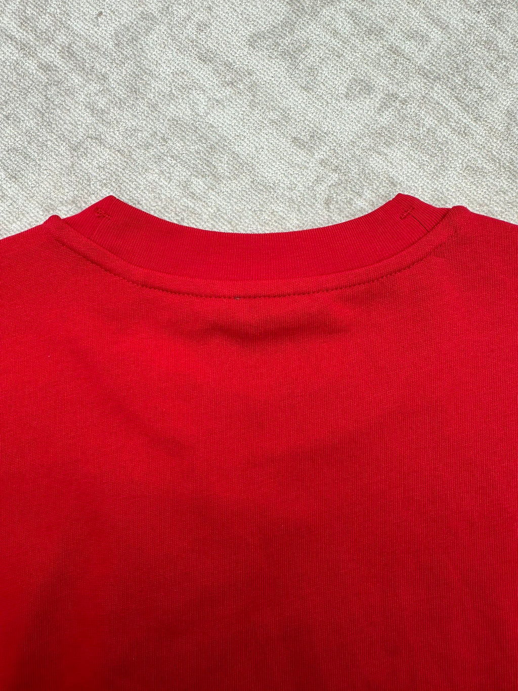 Red T-shirt neckline with crew neck collar seam detail