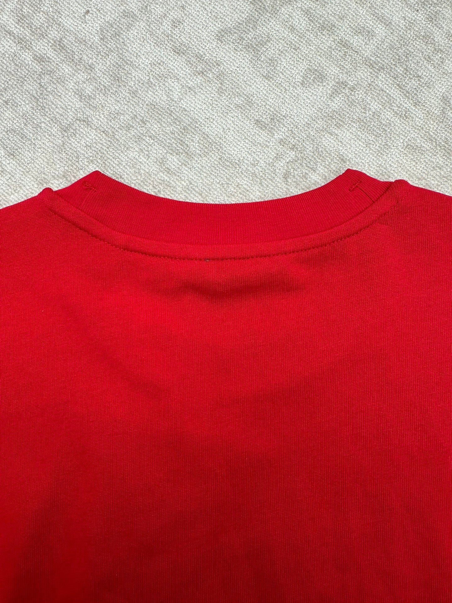 Red T-shirt neckline with crew neck collar seam detail