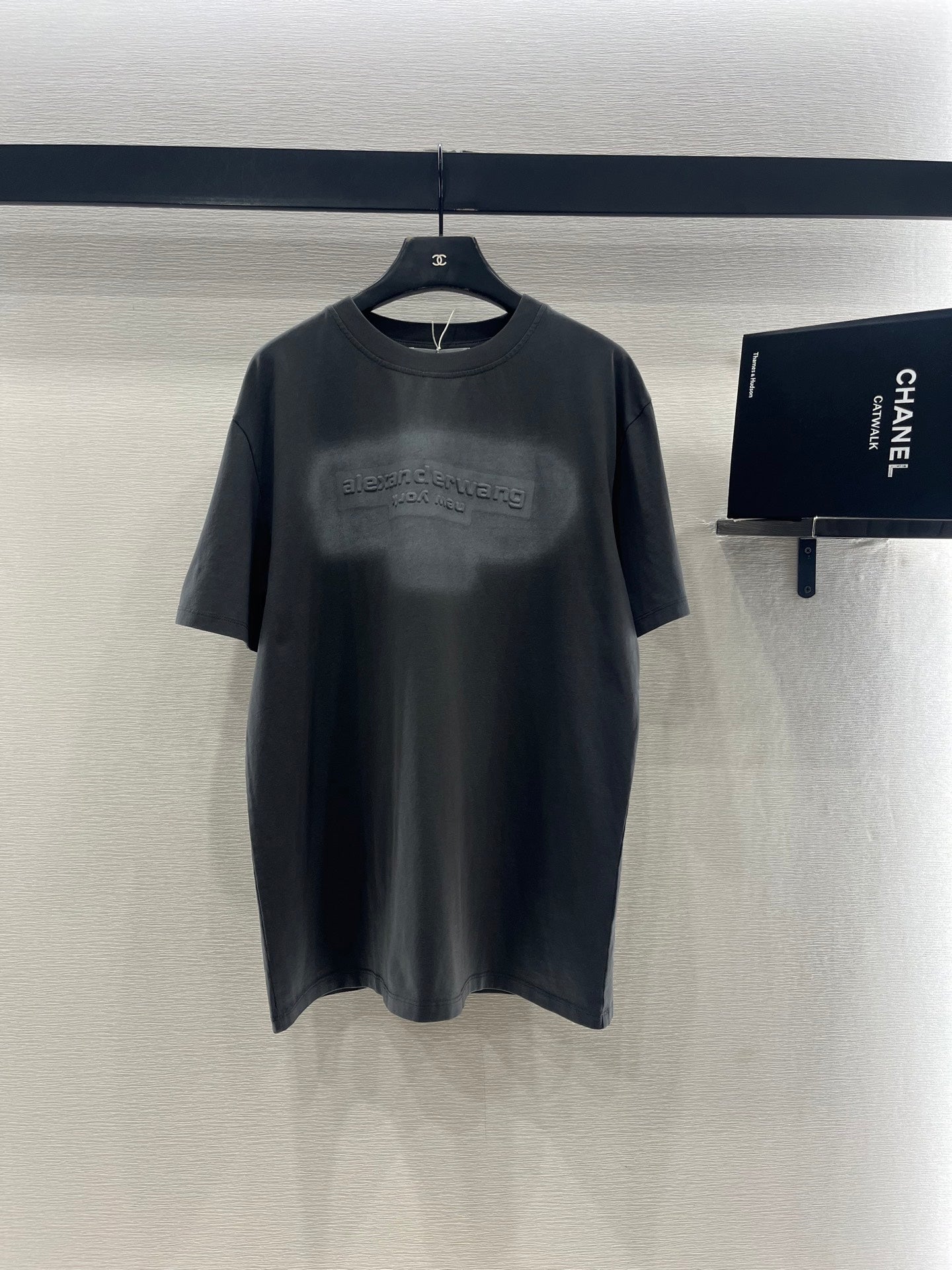 Dark gray crew-neck short-sleeve T-shirt with small chest logo print