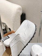 Balenciaga white slide sandals, open heel view with black sole tread