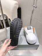 Balenciaga slide sandals, black outsole with BALENCIAGA text and tread detail