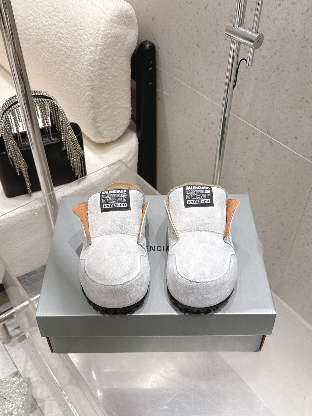 Balenciaga white slide sandals with black tread sole and logo strap