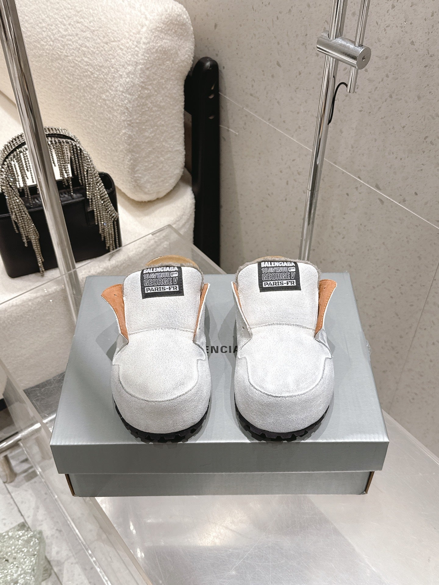 Balenciaga white slide sandals with black tread sole and logo strap