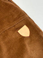 Louis Vuitton brown corduroy pants with triangle logo patch on the side