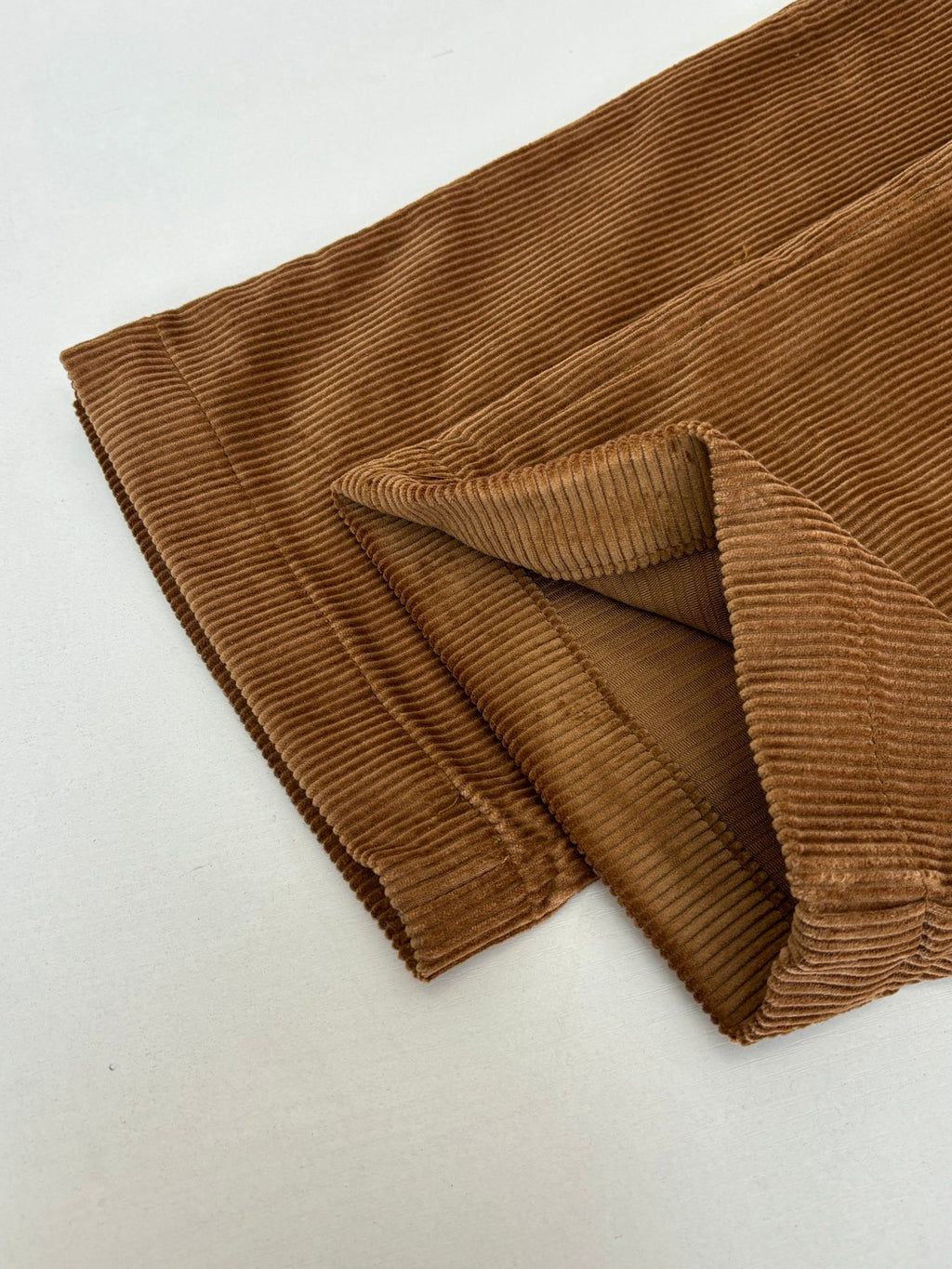 Brown corduroy pants with pleated front and wide leg