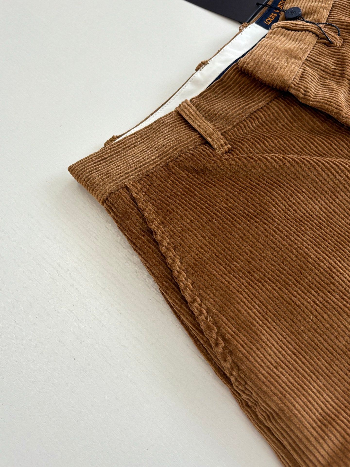 Louis Vuitton brown corduroy pant hem with ribbed texture and stitched cuff