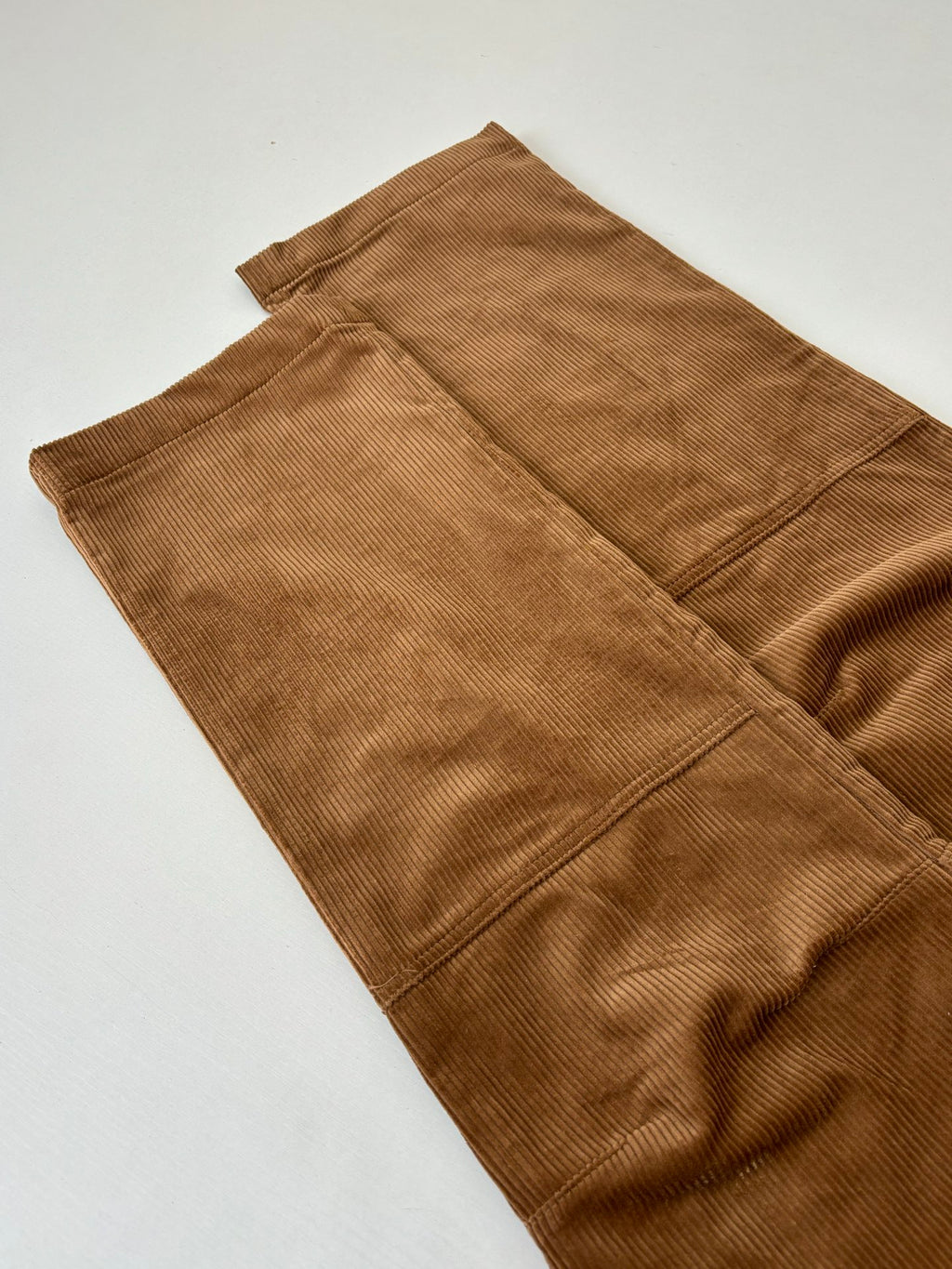 Louis Vuitton brown corduroy pants folded flat with front pockets and seams