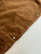 Louis Vuitton brown corduroy pant cuff with small star-shaped embellishments