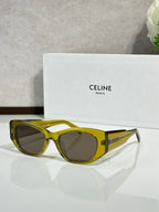 Celine sunglasses with olive-yellow frames and dark round lenses