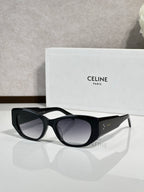 Celine sunglasses with black frames and dark gray tinted lenses