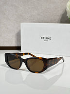 Celine sunglasses with black frames, tortoise temples, and dark round lenses