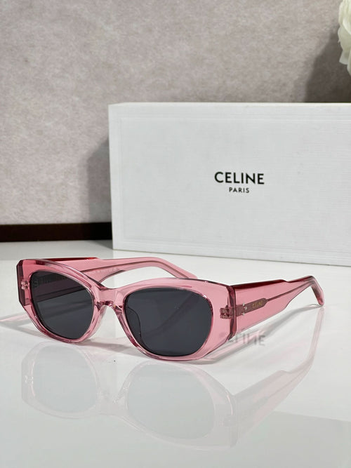 Celine sunglasses with pink frames and dark round lenses, cat-eye style