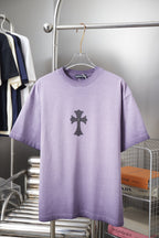 Lavender short-sleeve graphic T-shirt with dark cross emblem on the front