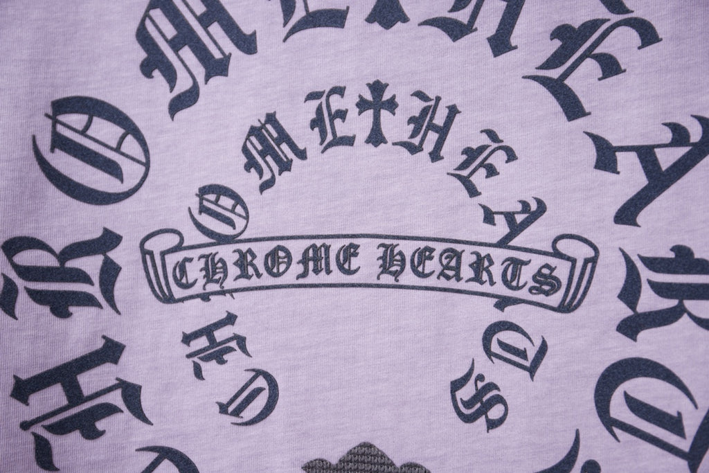 Lavender T-shirt fabric with dark decorative letter and symbol print