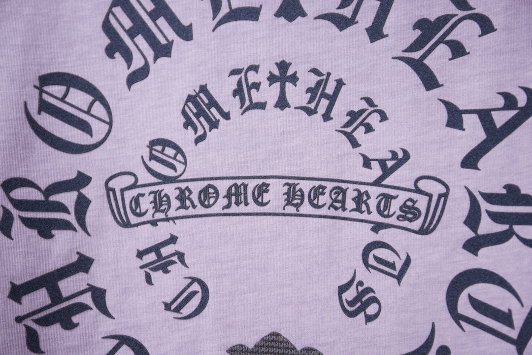 Lavender T-shirt fabric with dark decorative letter and symbol print