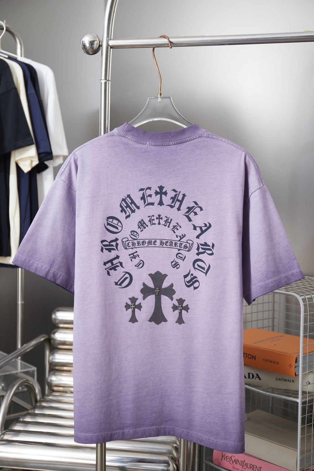 Lavender short-sleeve T-shirt with dark back graphic text and cross pattern