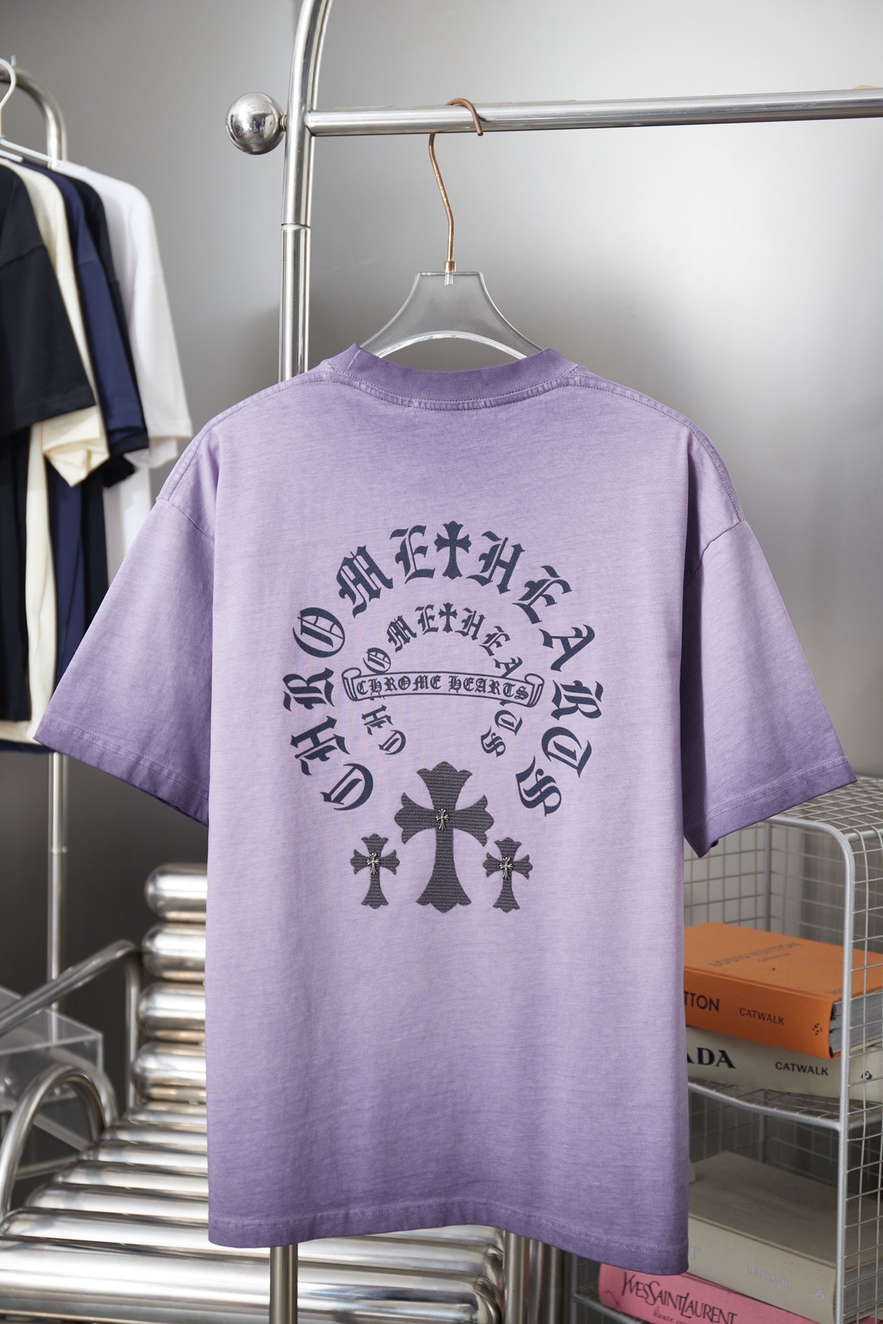 Lavender short-sleeve T-shirt with dark back graphic text and cross pattern