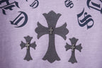 Lavender T-shirt with dark cross icons and decorative symbol graphics