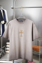 Light gray T-shirt with embroidered cross graphic at center front.