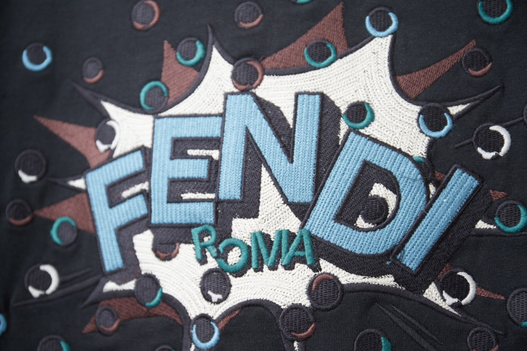 Fendi navy T-shirt close-up of FENDI text graphic with confetti accents