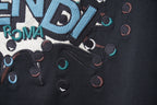 Fendi navy T-shirt close-up of lower graphic with confetti dots