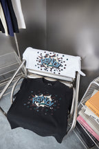 Set of Fendi navy and white T-shirts with colorful FENDI graphics on hangers