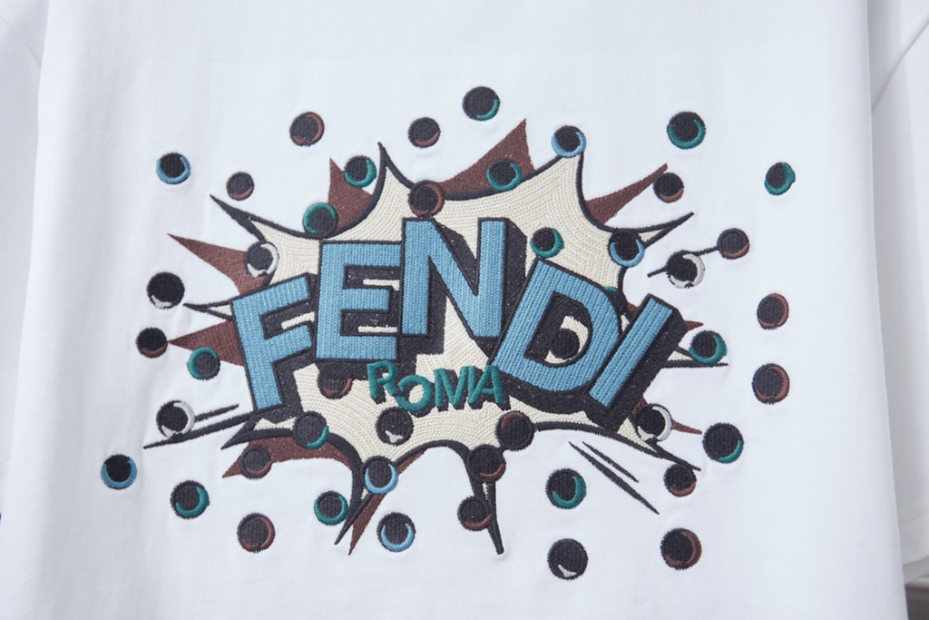 Fendi logo graphic on white T-shirt, blue FENDI text with splash accents