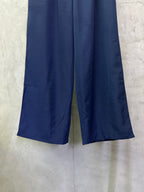 Blue wide-leg pants with elastic waistband and drawstring at front