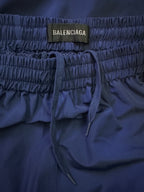 Blue elastic waist pants with BALENCIAGA label and tie drawstring