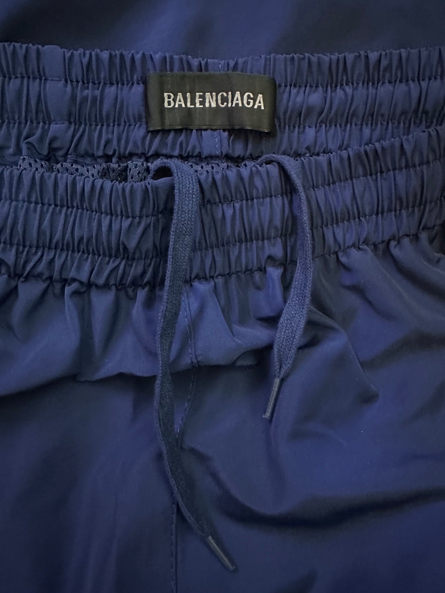 Blue elastic waist pants with BALENCIAGA label and tie drawstring