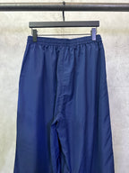 Blue wide-leg pants with pleated front and elastic drawstring waistband