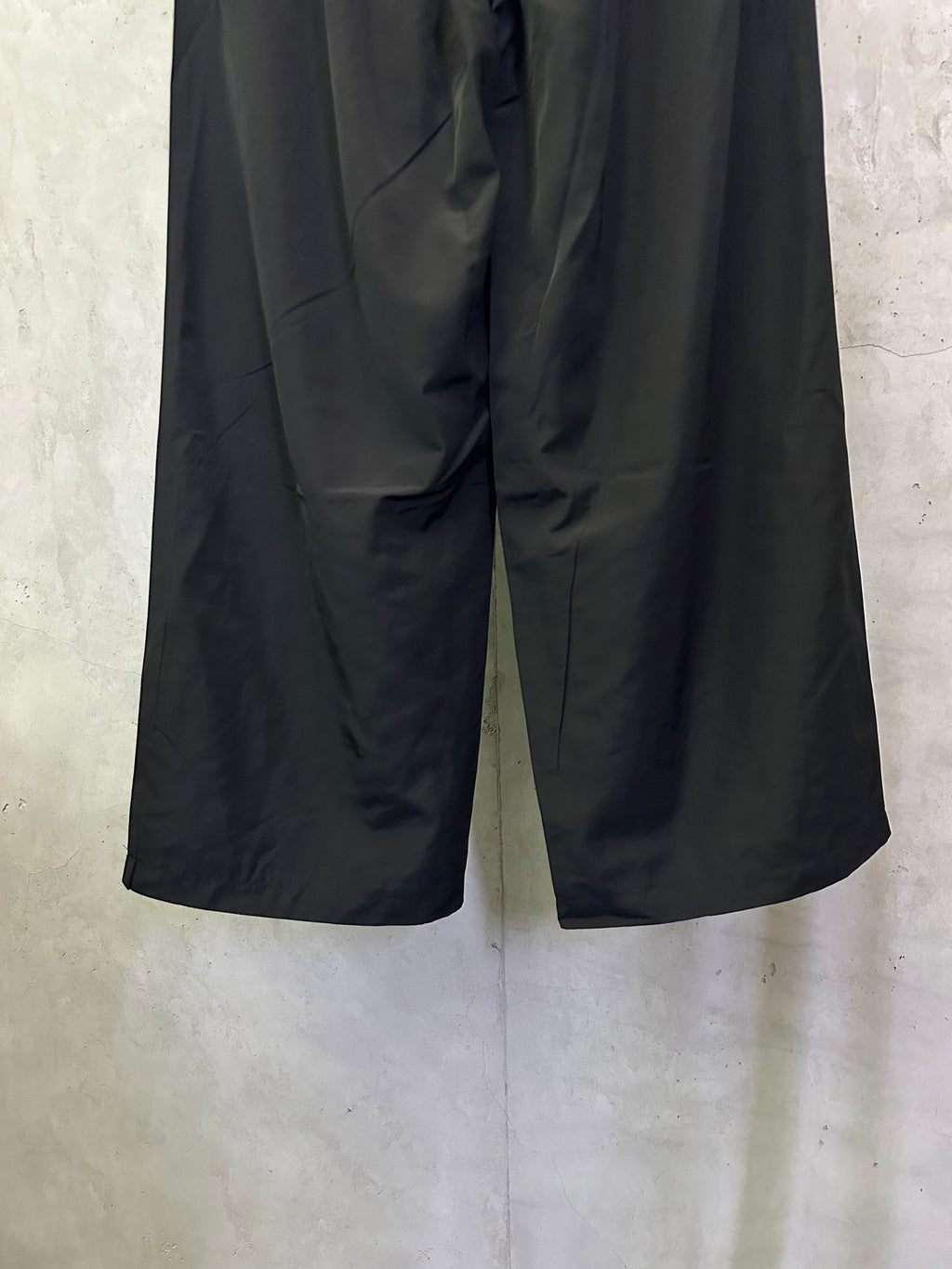 Balenciaga black wide-leg pants with loose fit and visible front seams