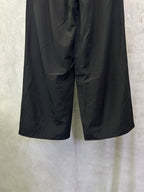 Balenciaga black wide-leg pants with loose fit and visible front seams
