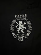 Balenciaga black pants with embroidered crest patch on the front