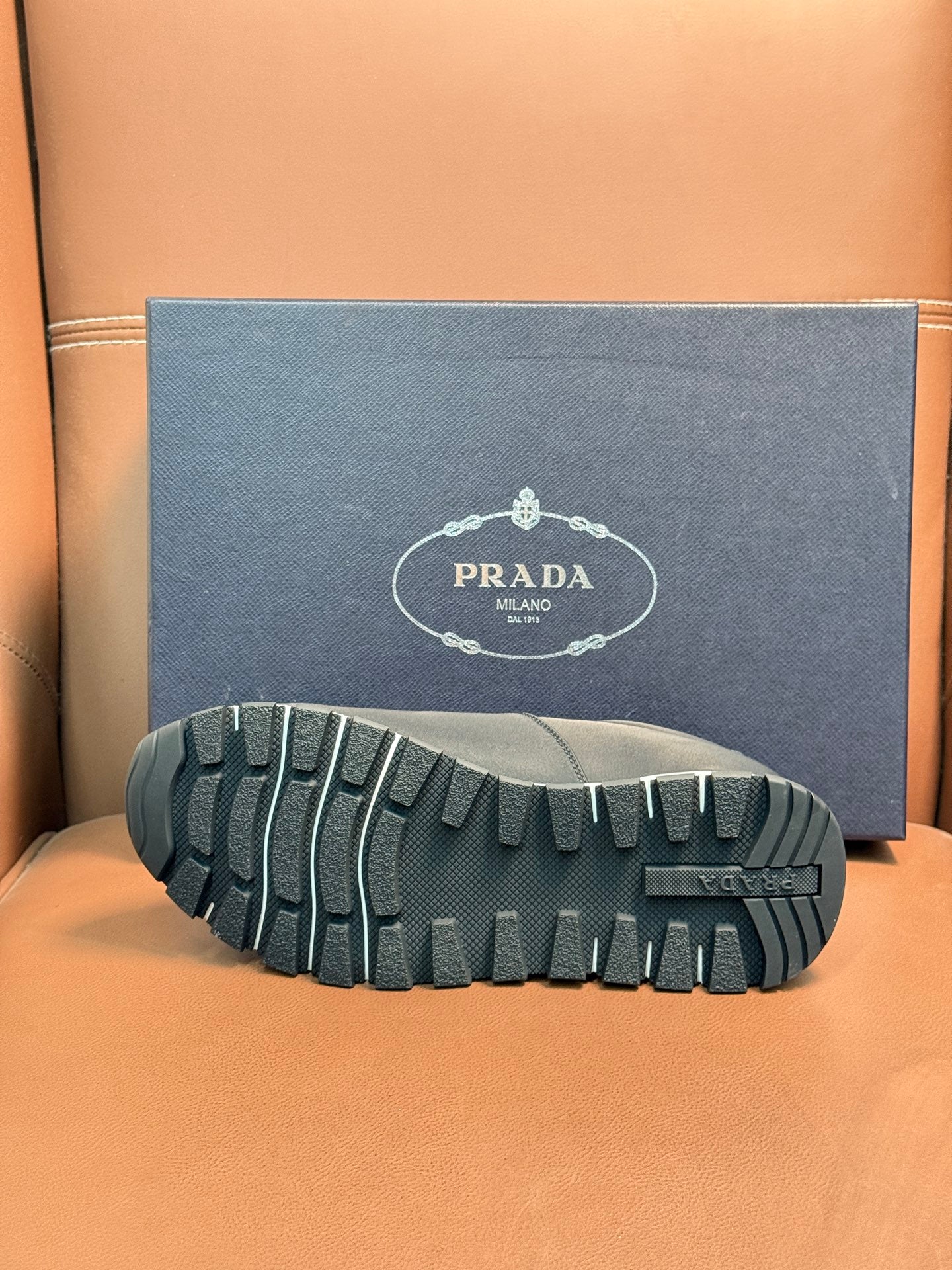 Prada sneaker outsole, black rubber tread with molded grip pattern