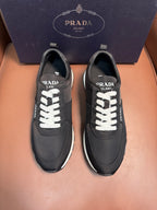 Black Prada leather sneakers, lace-up with white laces and rubber sole
