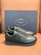 Silver leather lace-up sneakers with chunky black outsole and stitched detail