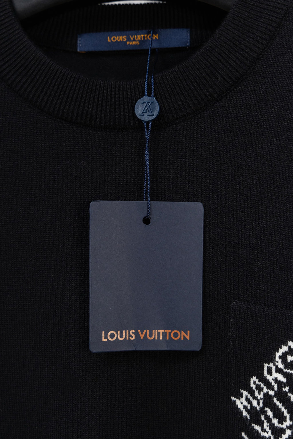Black crew neck sweater with Louis Vuitton tag and ribbed collar