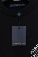 Black crew neck sweater with Louis Vuitton tag and ribbed collar