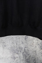 Black knit sweater hem with ribbed cuffs, plain knit texture