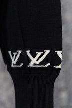 Black ribbed sweater cuff with repeating white LV monogram pattern