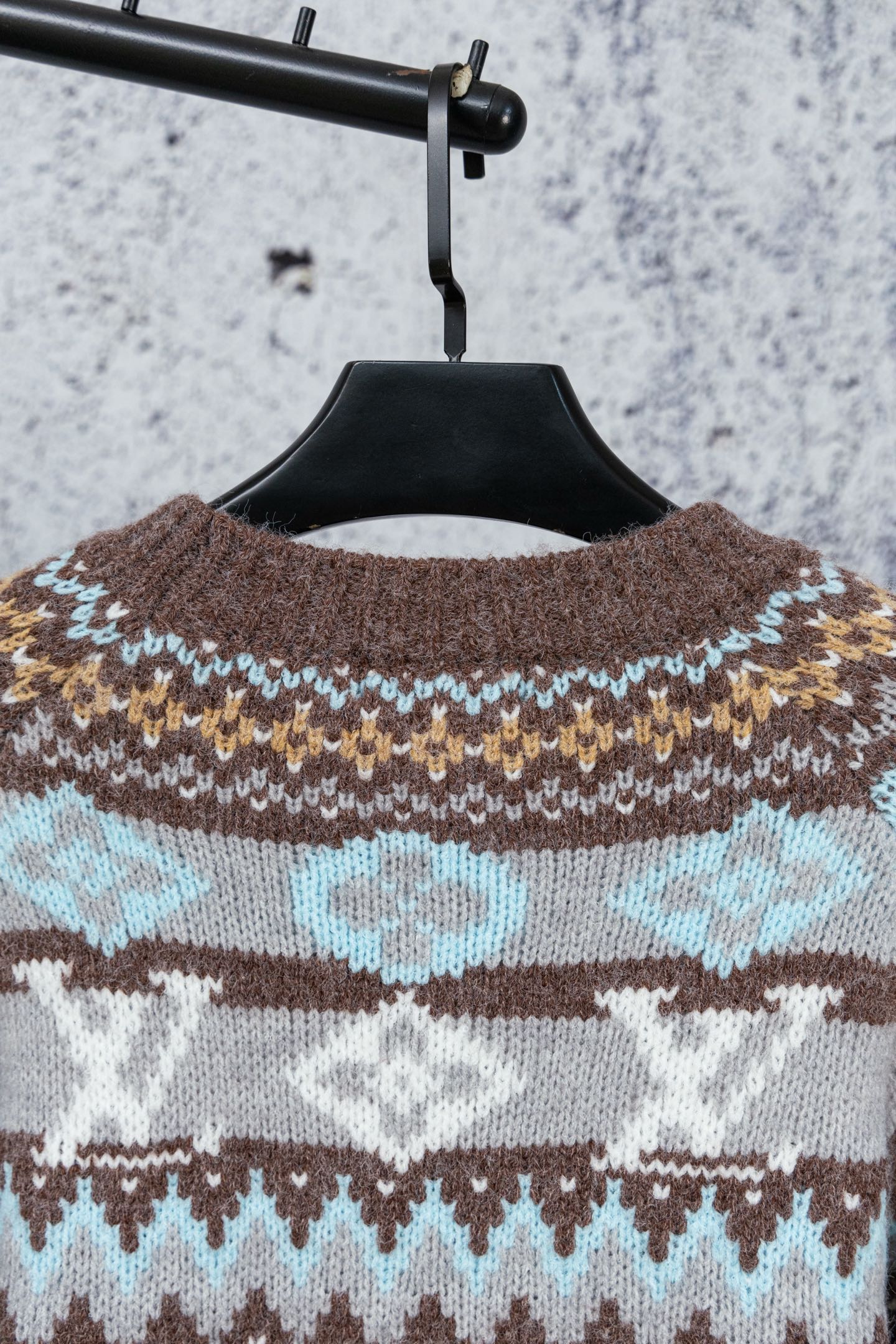 Brown knit sweater yoke with blue and cream fair isle pattern