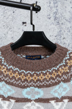Brown knit sweater neckline with Louis Vuitton neck label
