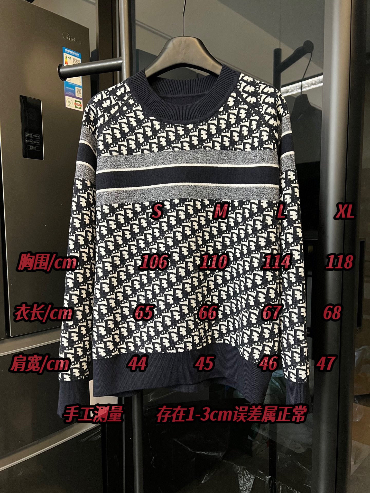 Long-sleeve knit sweater with white logo pattern, navy collar, and CHRISTIAN DIOR band