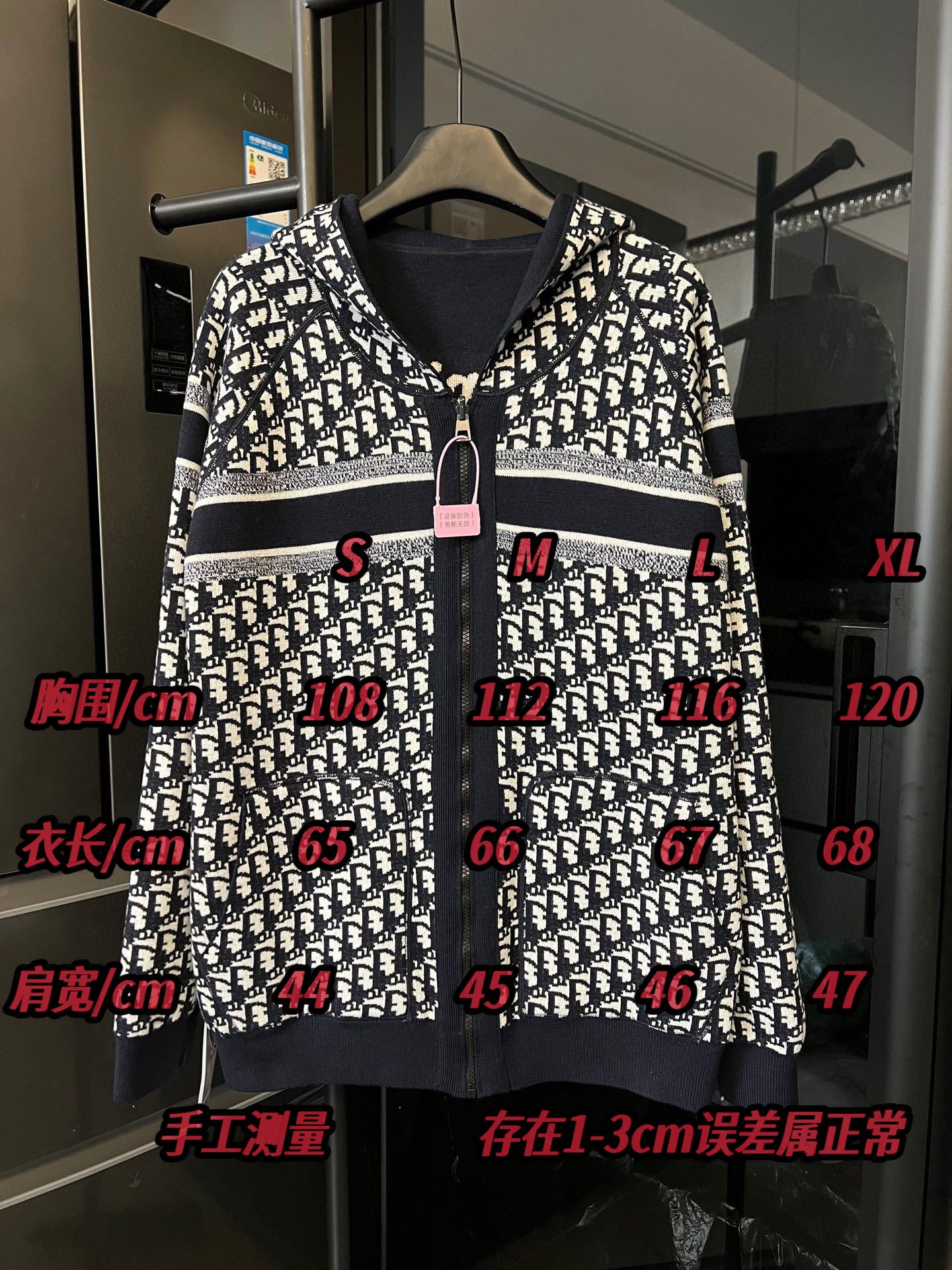 Dior long zip hoodie front in black-and-white logo print with center zipper and hood