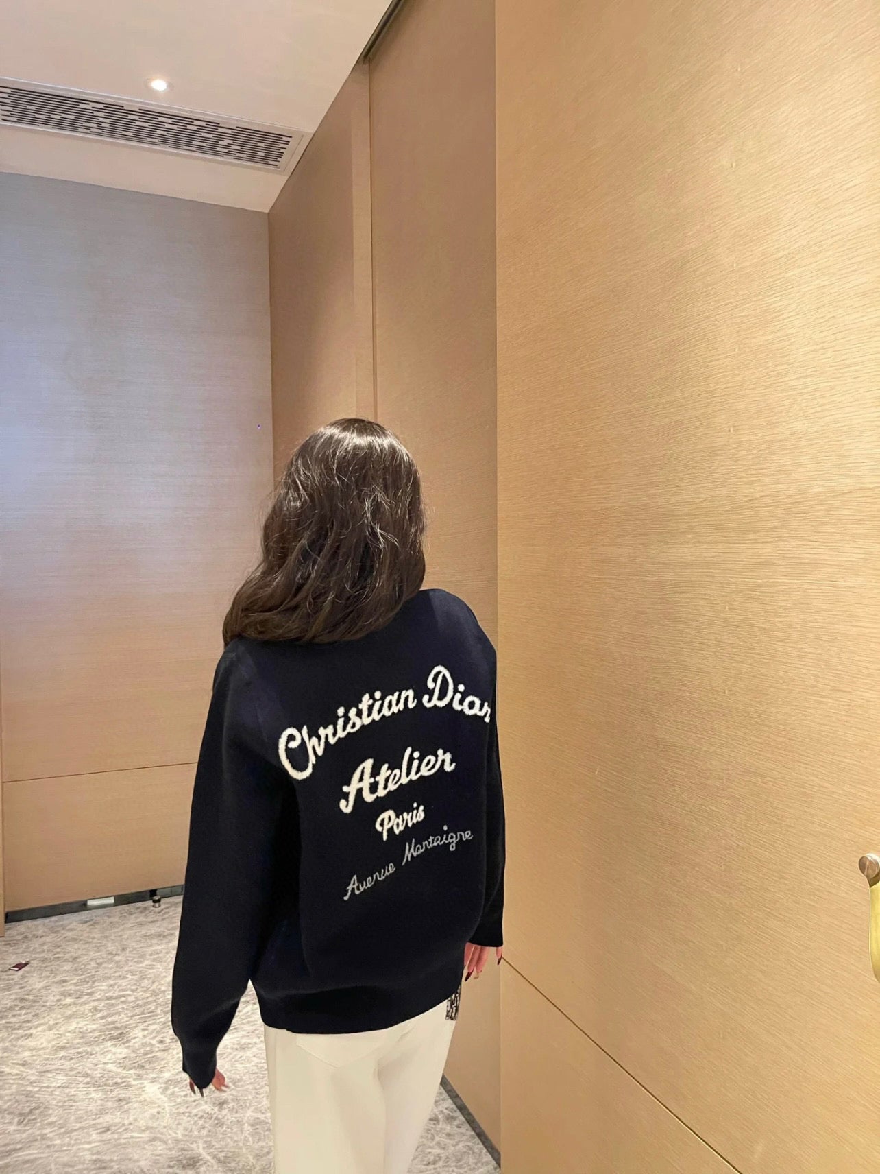Navy long-sleeve sweatshirt with Christian Dior script and logo on back